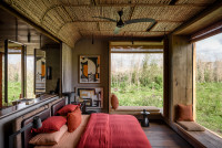 Singita Kwitonda bedroom with views of the volcanoes 