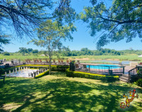 Wooden pool deck with swimming pool overlooking Kruger National Park