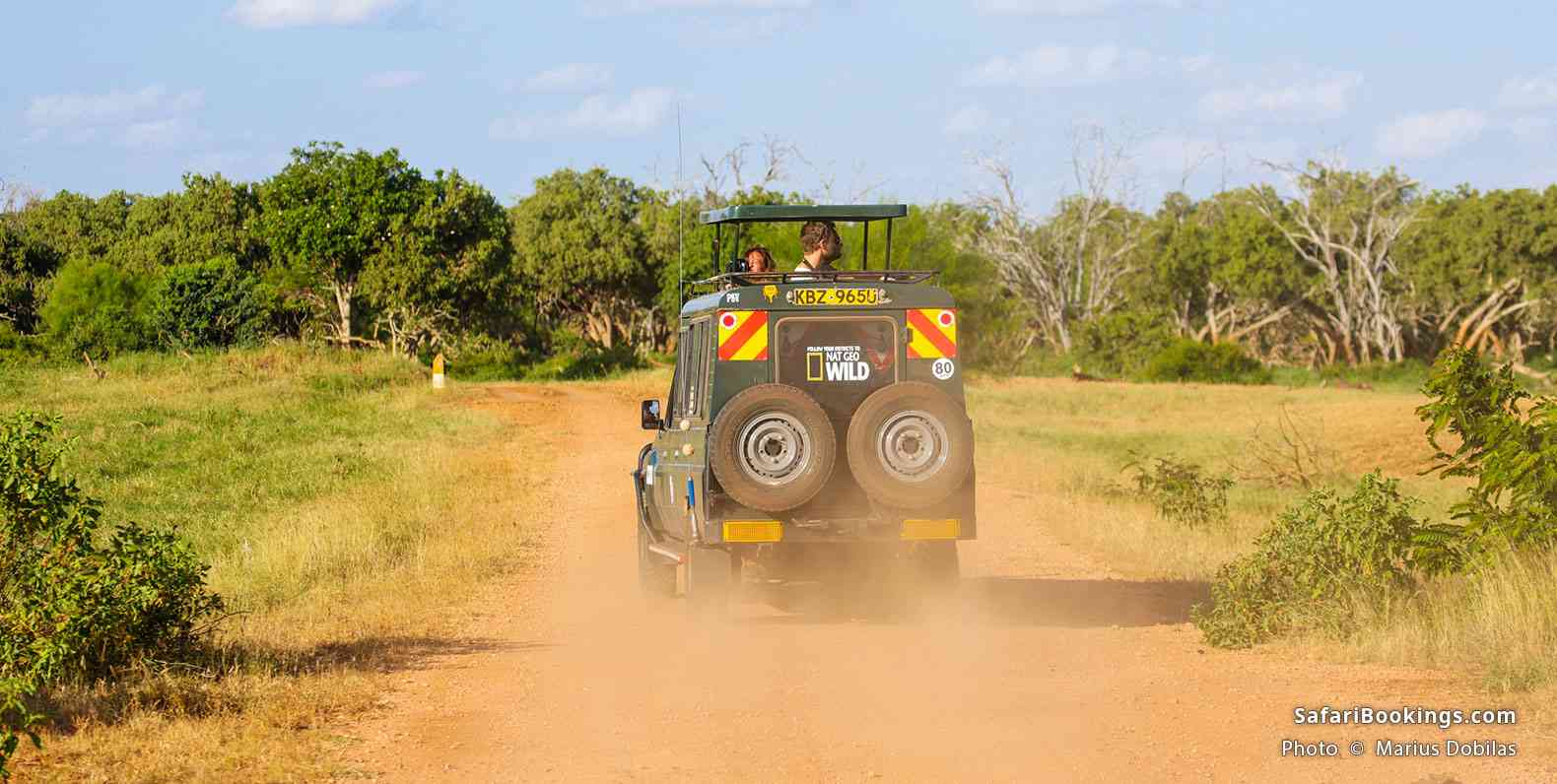 Safari vehicle on a dusty road