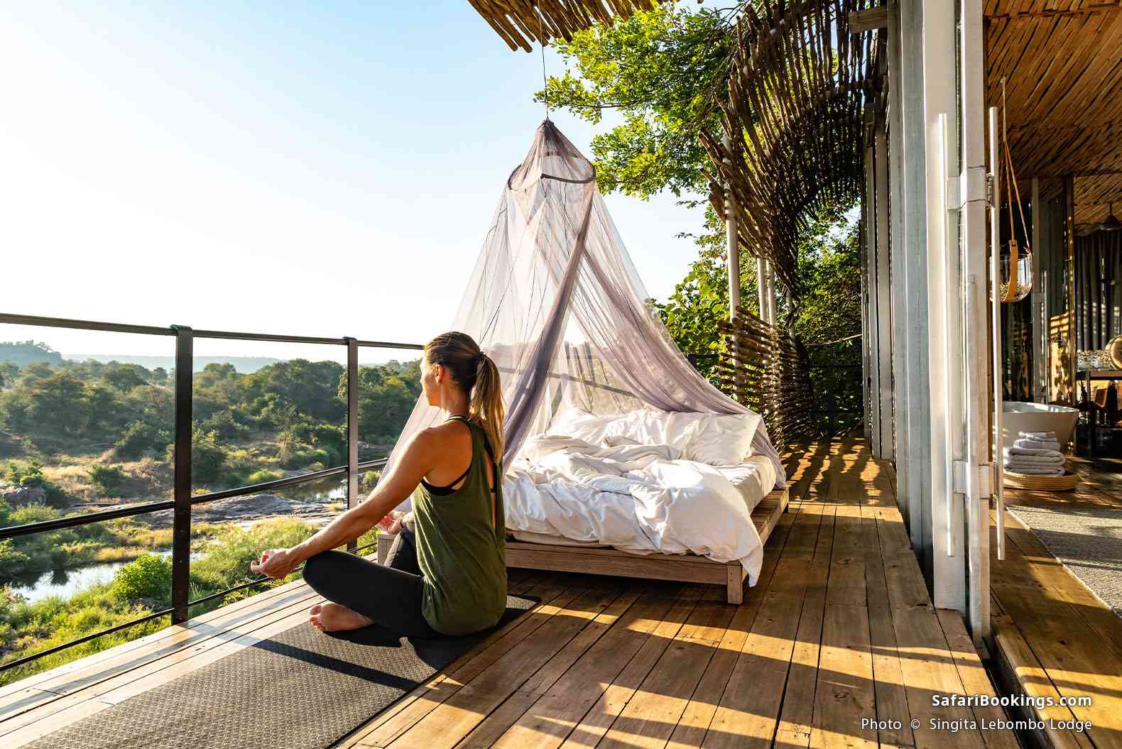 Traveler relaxing on a private terrace in Singita Lebombo Lodge