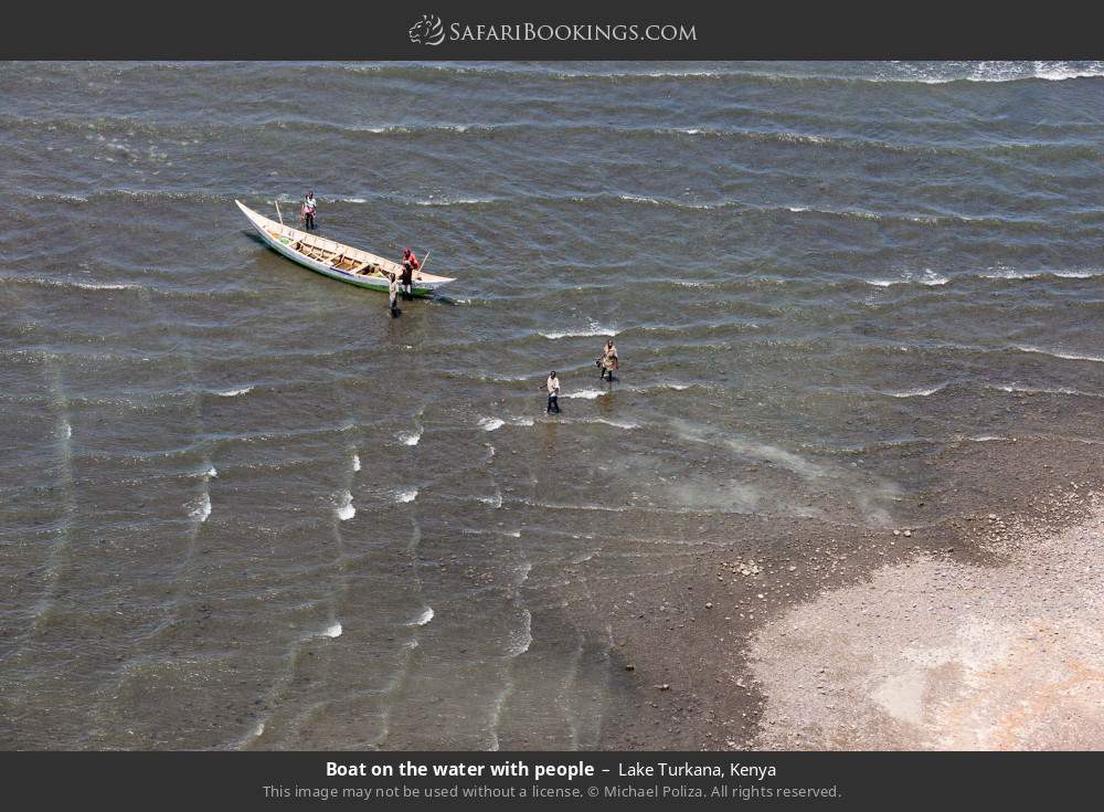 Boat on the water with people in Lake Turkana, Kenya