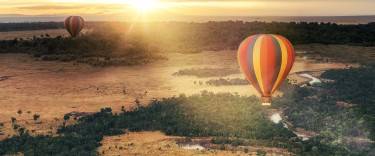 Hot-air balloons floating over the Masai Mara