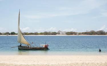 Traditional sailboat sailing between Manda Island and Lamu