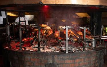 Meat on the grill at Carnivore Restaurant
