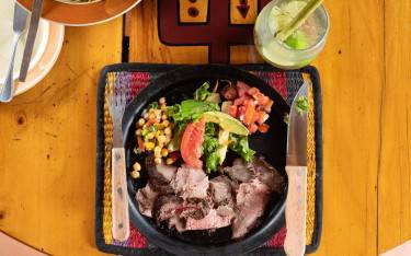 Grilled meat and salad at the Carnivore Restaurant
