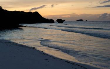 Coral outcrop and beach at sunrise in Turtle Bay