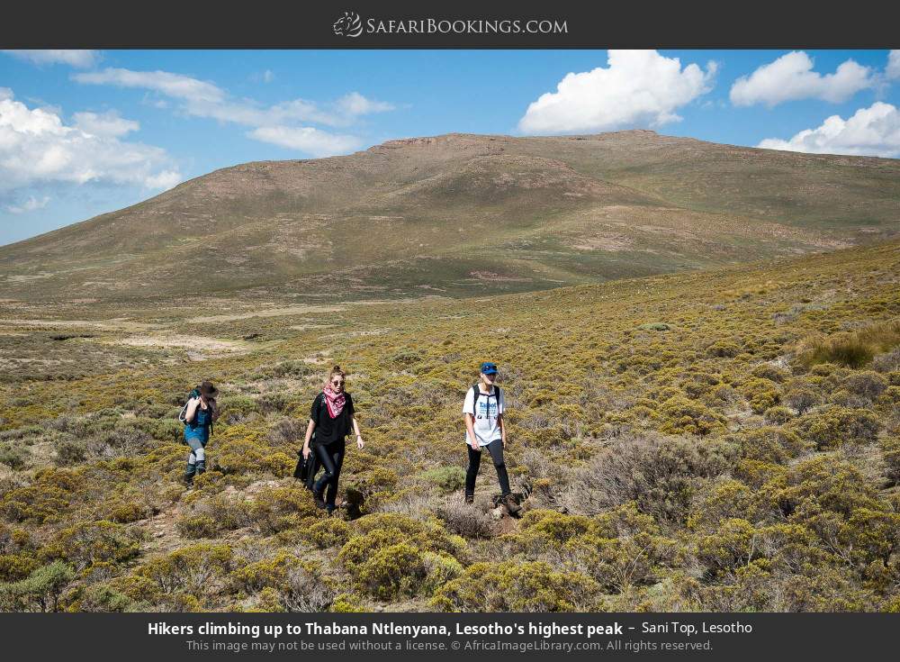 Hikers climbing up to Thabana Ntlenyana, Lesotho's highest peak, in Sani Top in Sani Top, Lesotho