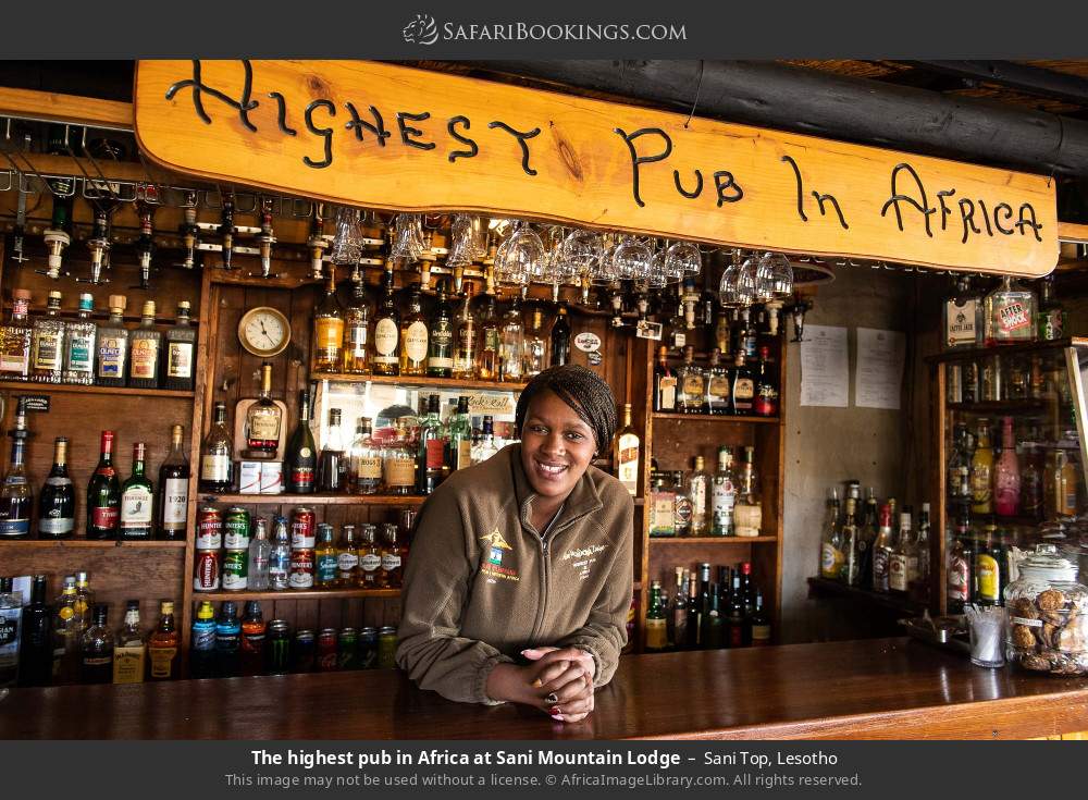 Server in the highest pub in Africa at Sani Mountain Lodge, Sani Top in Sani Top, Lesotho