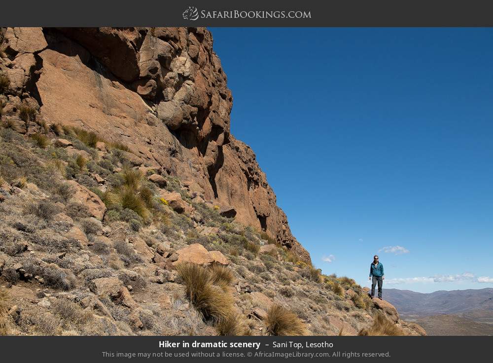 Hiker in dramatic scenery, Sani Top in Sani Top, Lesotho