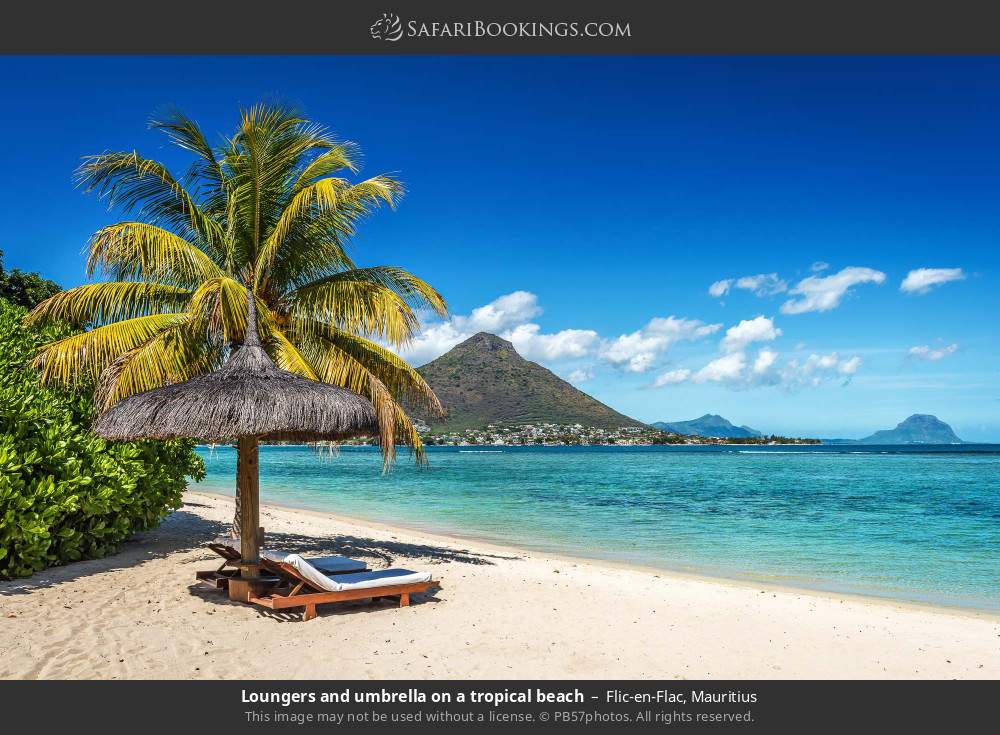 Loungers and umbrella at Flic-en-Flac Beach in Flic-en-Flac, Mauritius