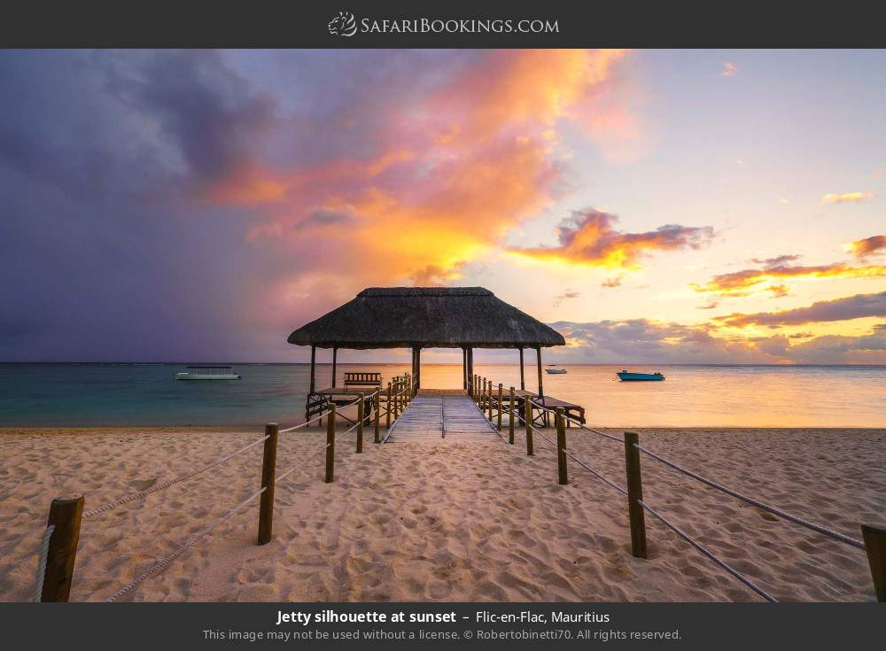 Jetty silhouette at sunset at Flic-en-Flac in Flic-en-Flac, Mauritius