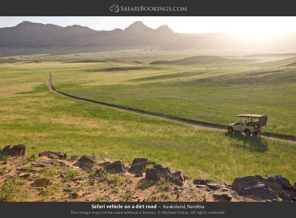 Safari vehicle on a dirt road in Kaokoland in Kaokoland, Namibia