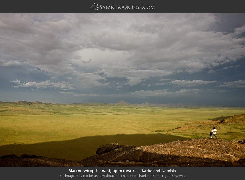 Man viewing the vast, open desert, Kaokoland in Kaokoland, Namibia