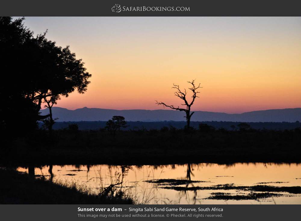 Sunset over a dam in Singita Sabi Sand Game Reserve, South Africa