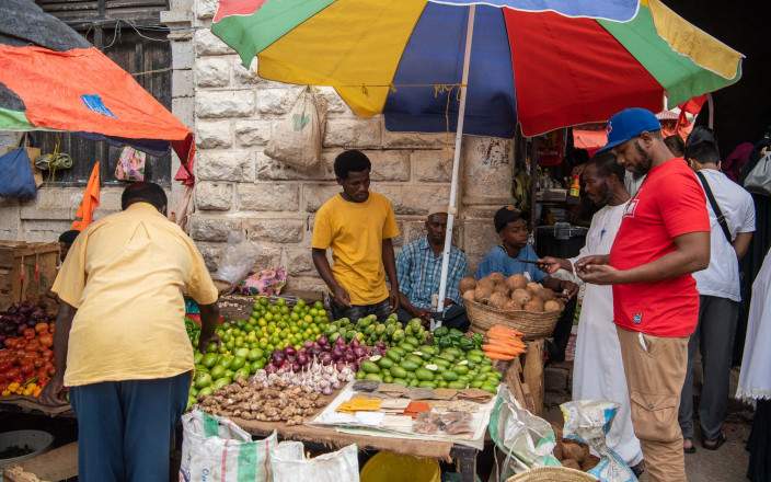 Weave between stalls at vibrant Darajani Market