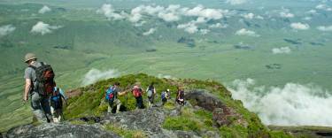 People hiking down the mountain