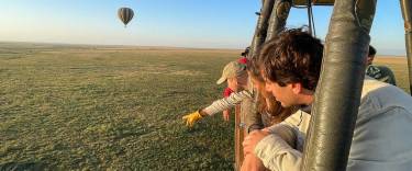 People enjoying a hot-air balloon safari