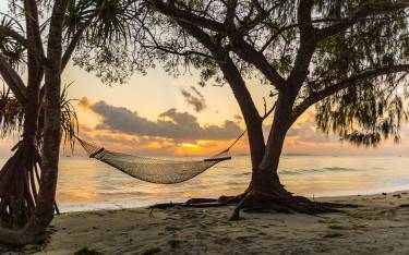 Hammock on a beach at Dar es Salaam at sunrise