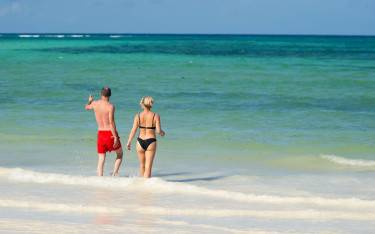 Thumbnail of People walking into the sea