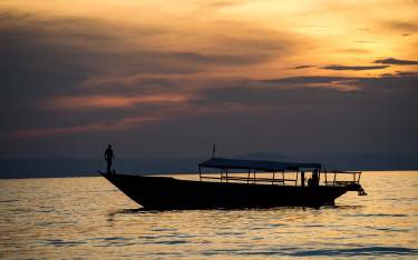 Boat on Lake Tanganyika at sunset