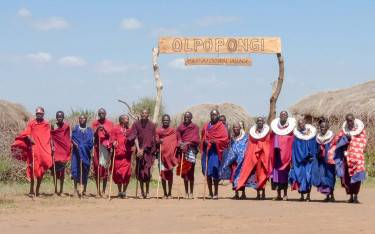 Maasai people welcoming guests at the village entrance