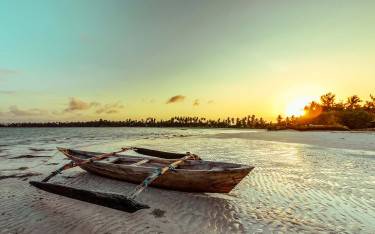 Thumbnail of Boat lying on the tidal flats at sunset