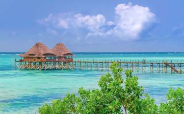 Thumbnail of Jetty leading to an overwater bar at Pwani Mchangani