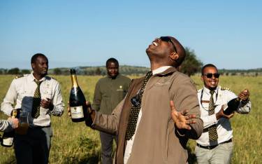 Champagne toast after a hot-air balloon safari