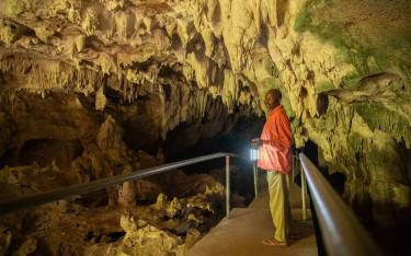 Guide leading the way in Kiwengwa Caves