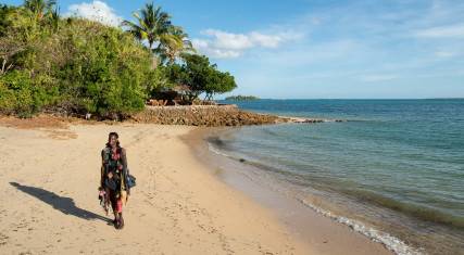 Maasai walking on the beach