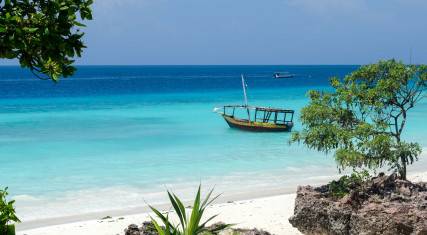 Wooden boat on turquoise water