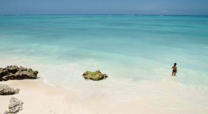 Woman wading in the sea