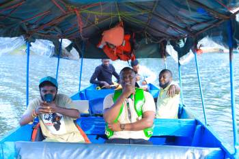 Our team on a boat cruise at Lake Bunyonyi 